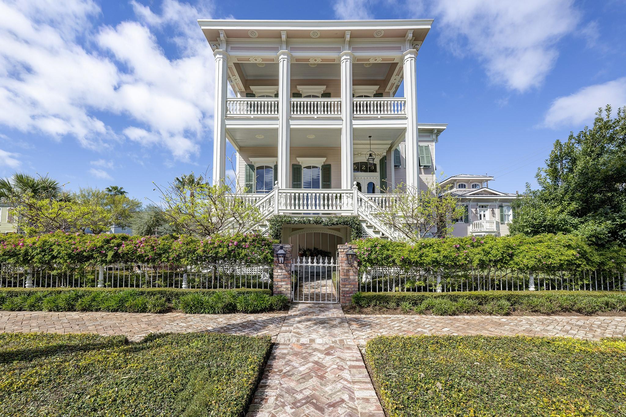 Image 2: Centered front elevation showcasing the home&rsquo;s dou