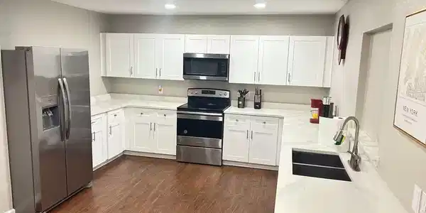 Image 4: Bright open concept layout with durable flooring t