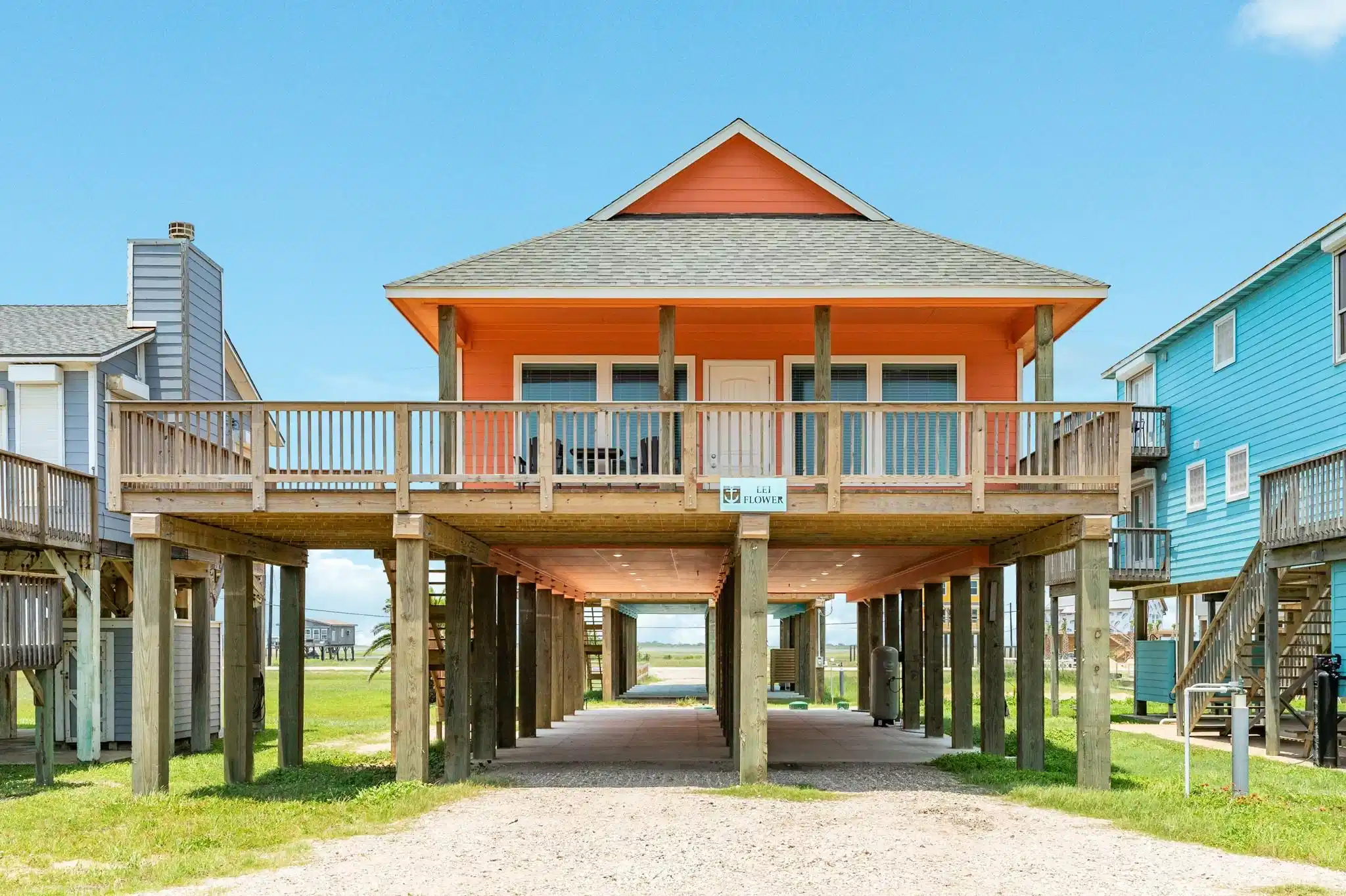 Image 1: This is a vibrant, elevated beach house with a spa