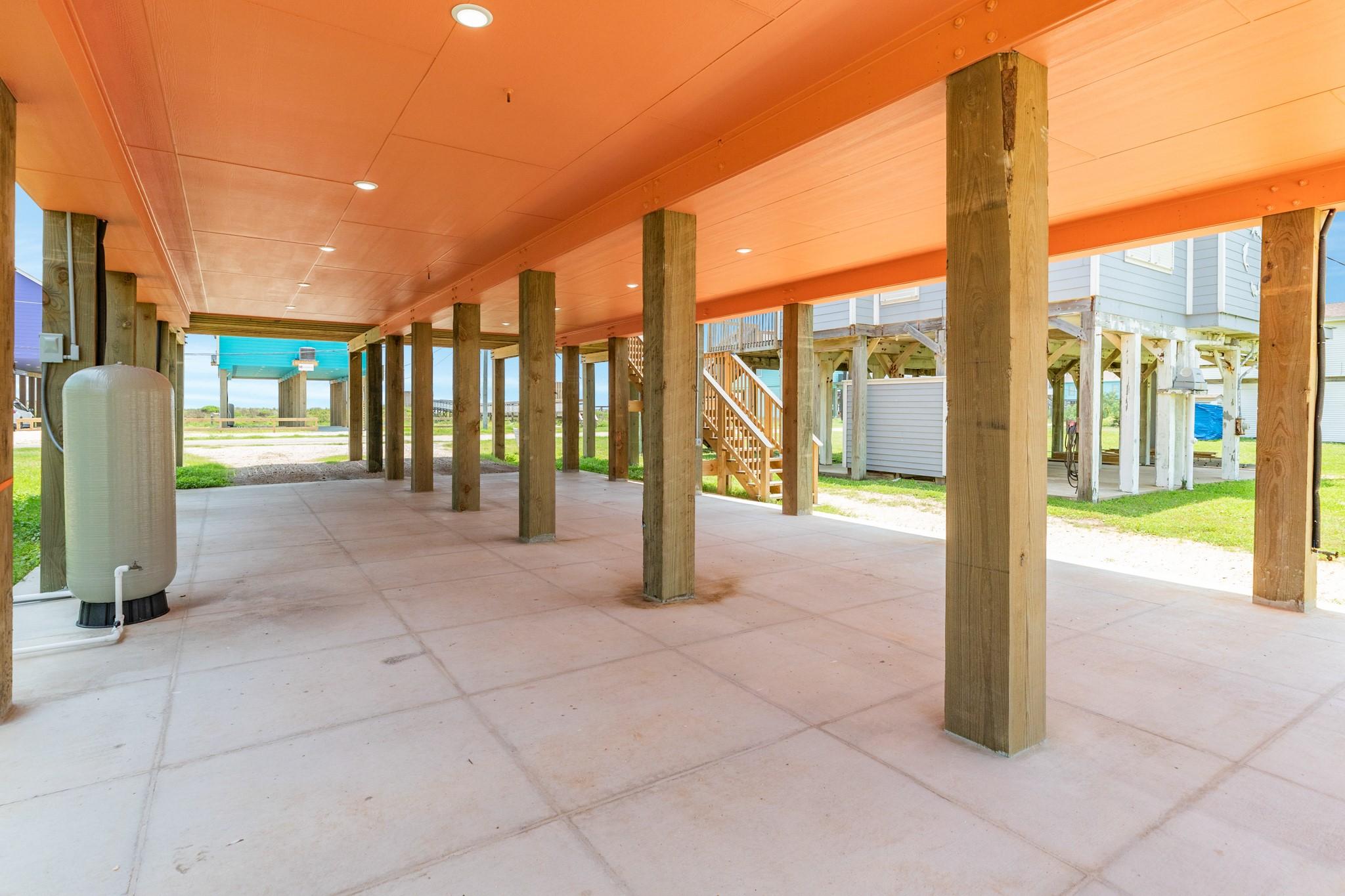 Image 3: This photo shows a spacious covered patio or carpo