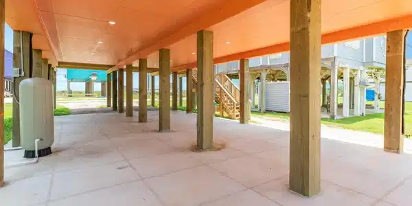 Image 3: This photo shows a spacious covered patio or carpo