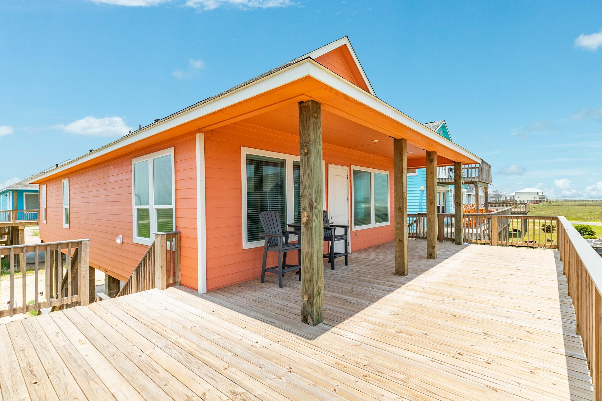 Image 4: This photo showcases a charming beach house with v
