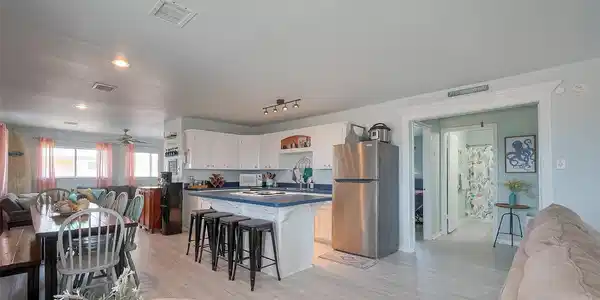 Image 3: Spacious and inviting, this open-concept kitchen a