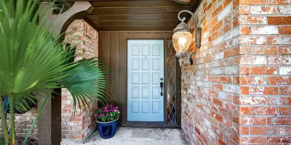 Image 3: Front entry with decorative diamond sidelight.