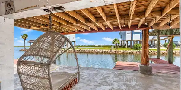 Image 4: A huge covered area beneath the home dramatically