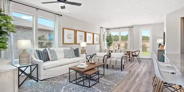 Image 3: Bright and airy open-concept family room featuring