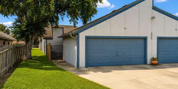 Image 2: Front- 2 car garage, 2 car driveway