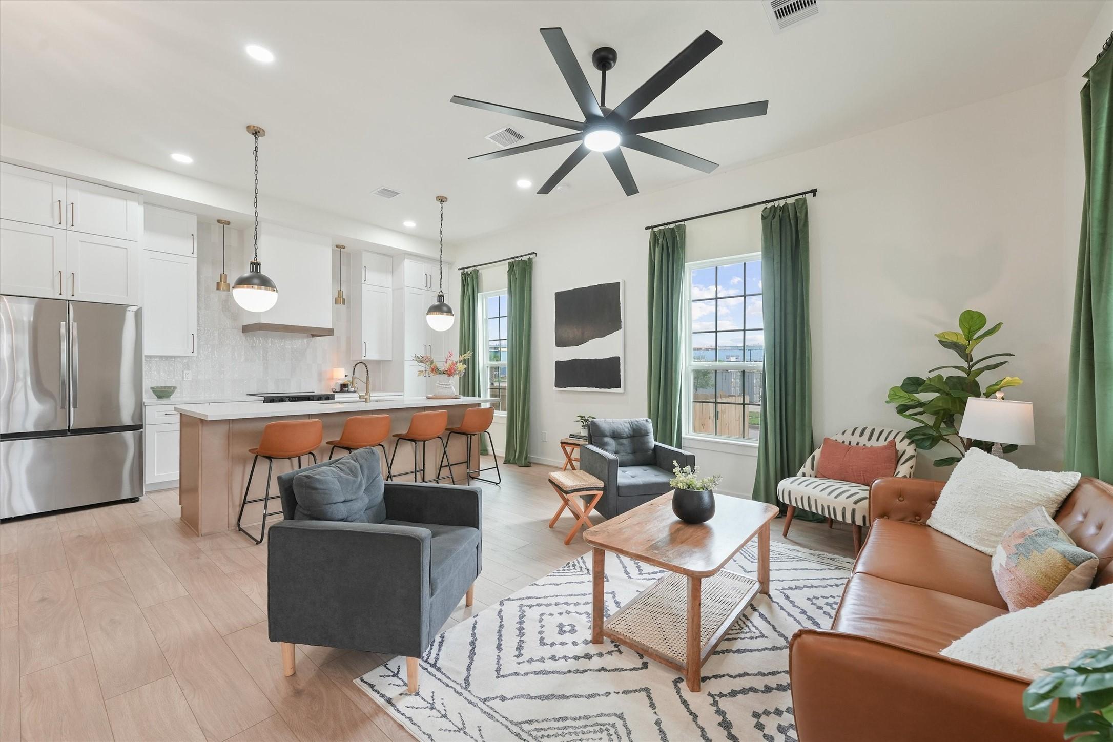 Image 3: Large open living room and kitchen area.