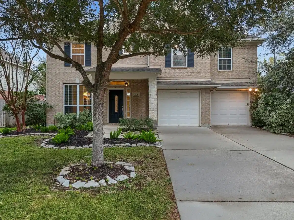 Image 1: Welcoming Brick and Stone front elevation.