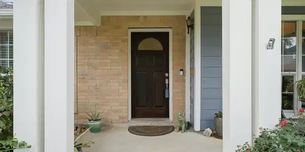 Image 4: Welcoming covered entry featuring a charming front