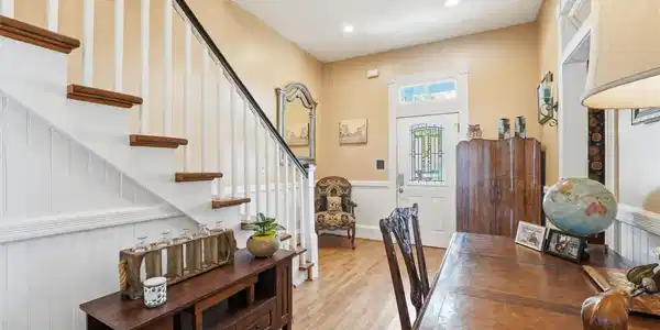 Image 4: Spacious foyer with high ceilings, natural light,