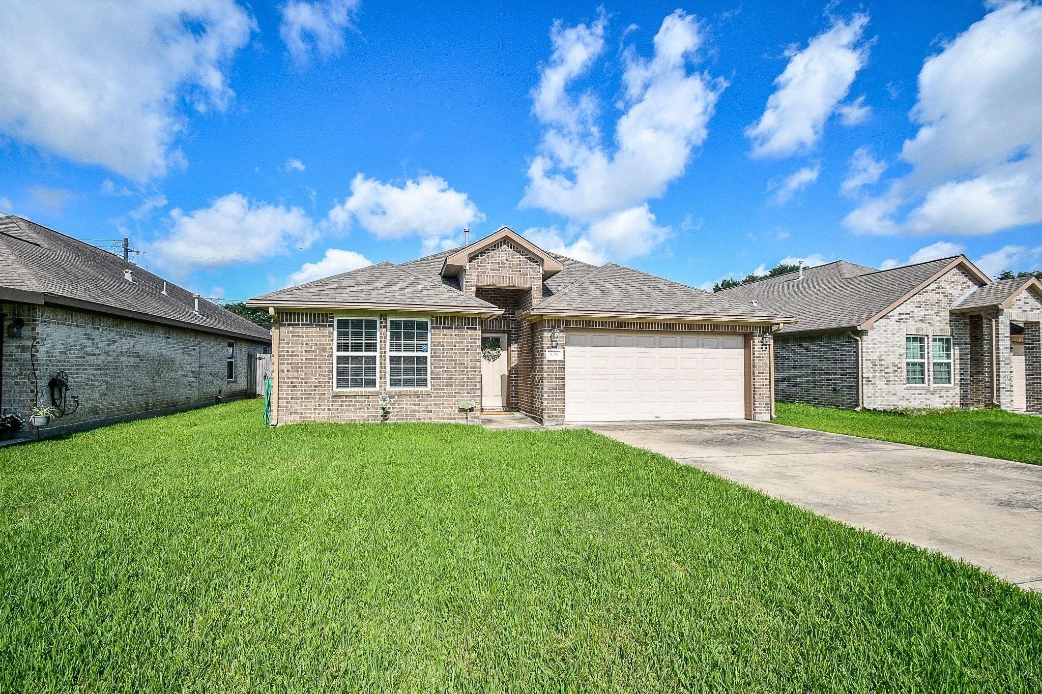 Image 2: This home has extra driveway parking plus a two ca