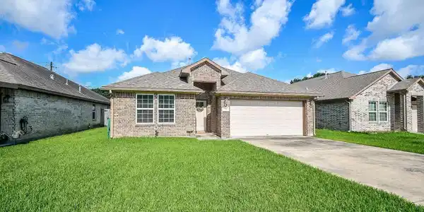 Image 2: This home has extra driveway parking plus a two ca