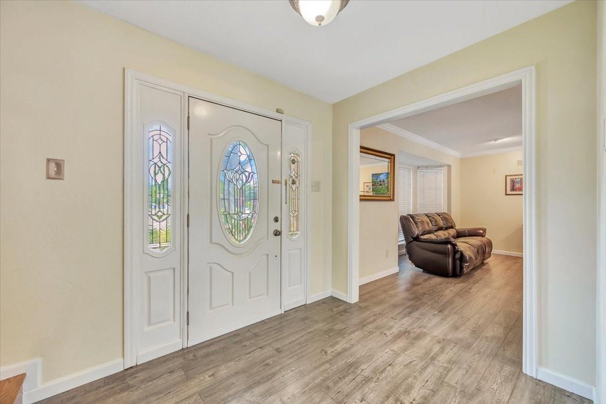 Image 2: Welcoming foyer with easy flow into the adjoining
