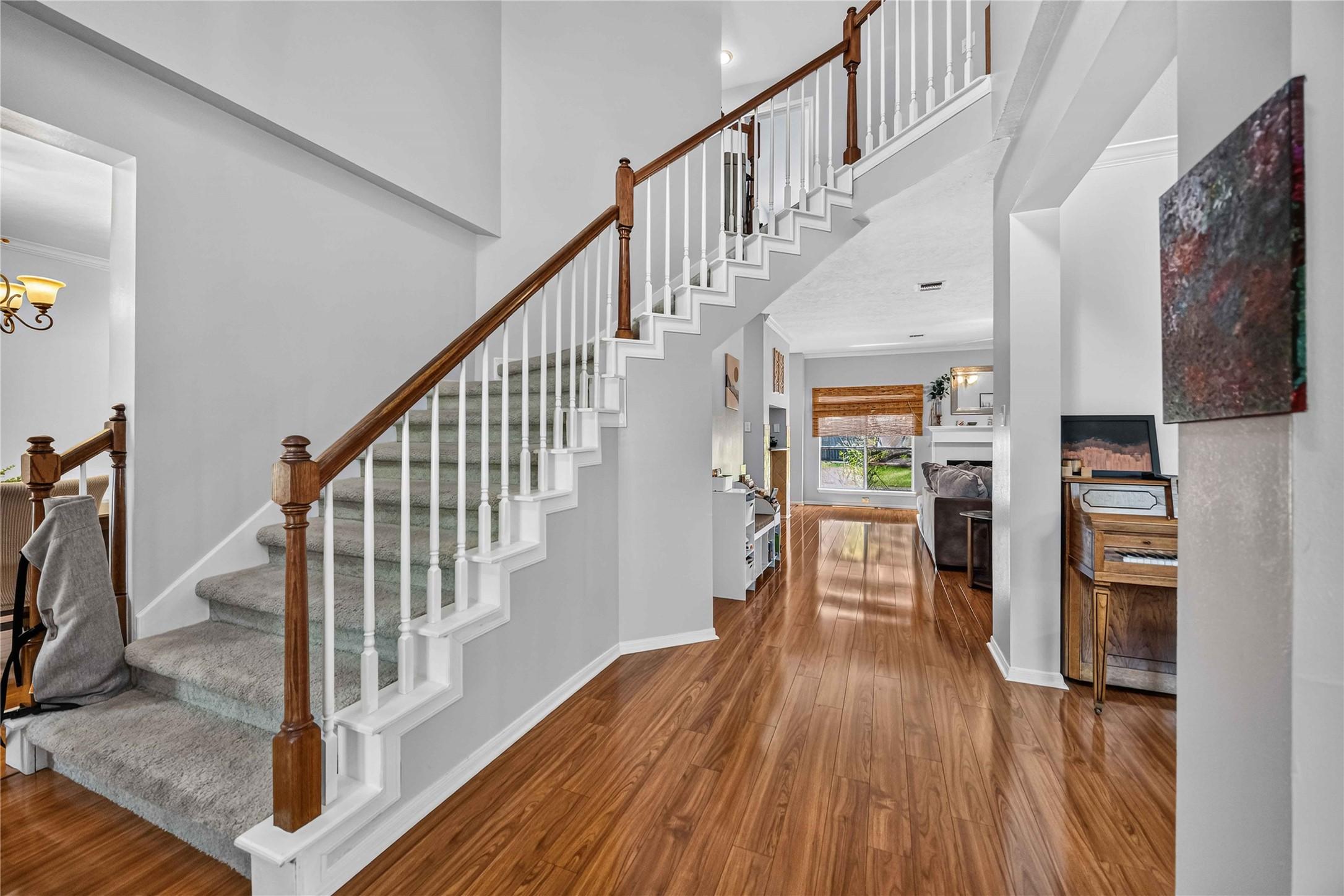 Image 4: Elegant entryway featuring a beautiful staircase w
