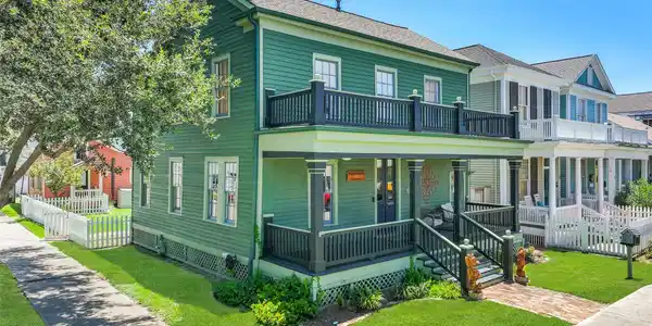 Image 2: Situated on a 5,313-square-foot corner lot, this h