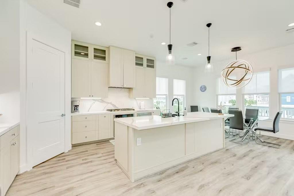Image 2: This home features an elegant kitchen with a Cafe