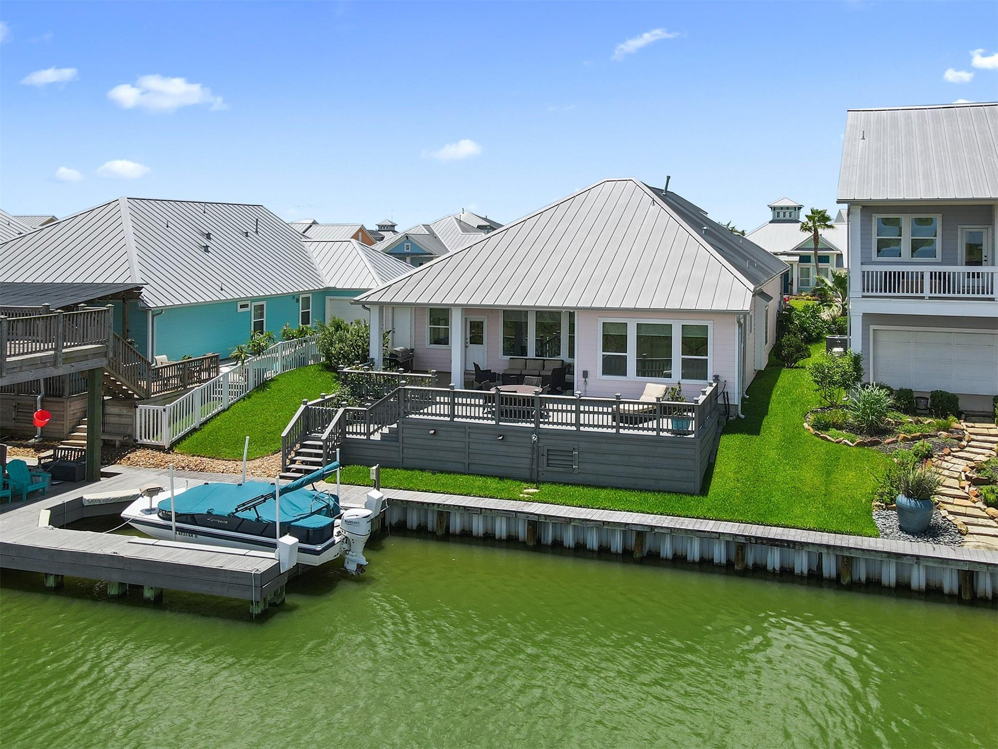 Image 1: One story home with a boat lift  and generator in