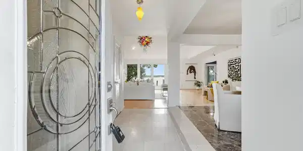 Image 3: Entry: Light-filled entry offers an immediate sigh