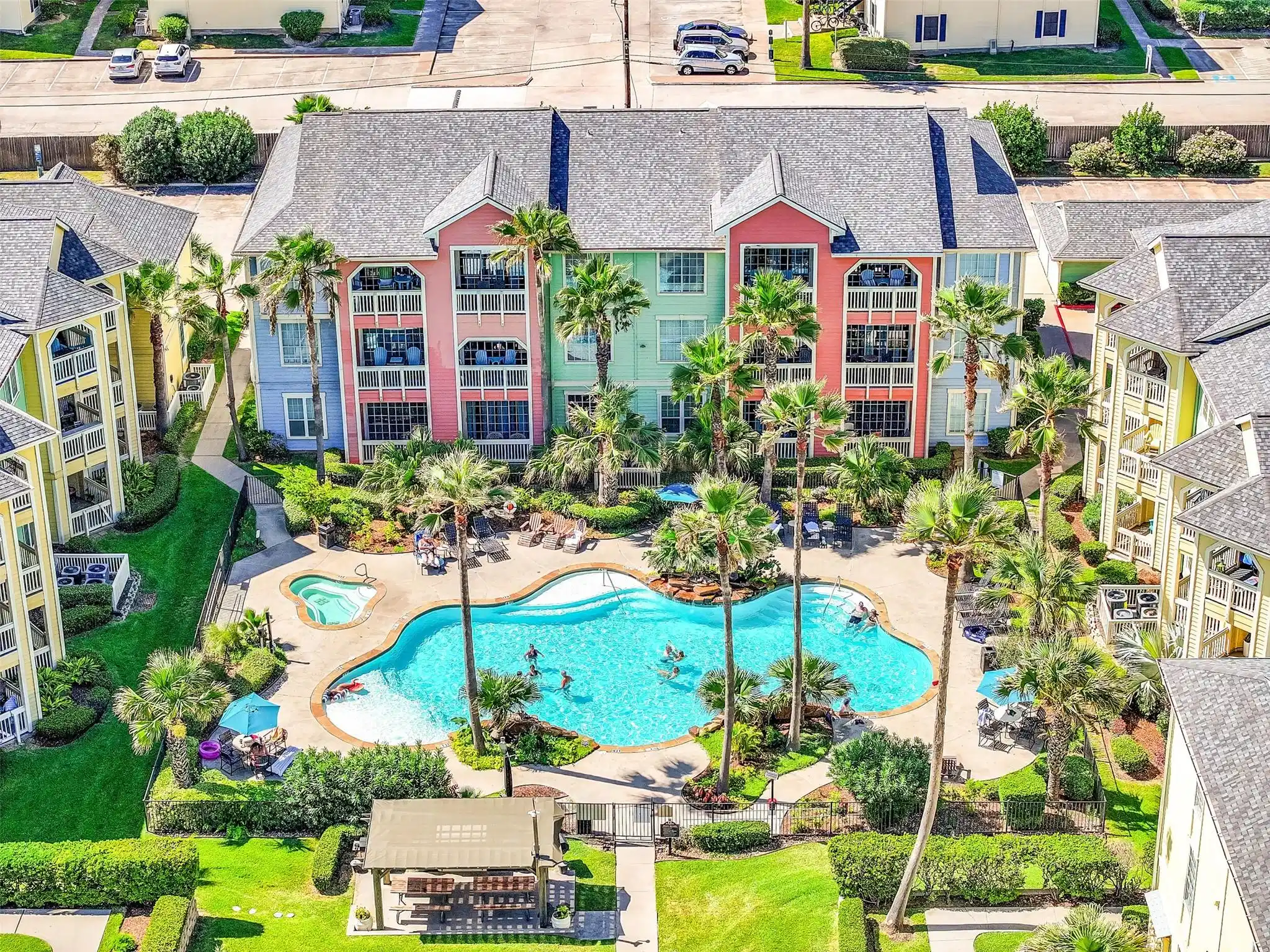Image 1: This inviting pool courtyard brings a true resort