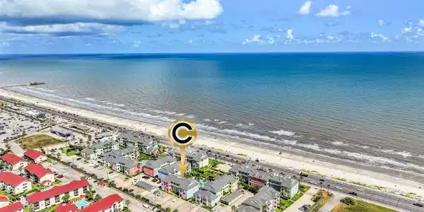 Image 2: A sweeping aerial captures the expansive Gulf shor