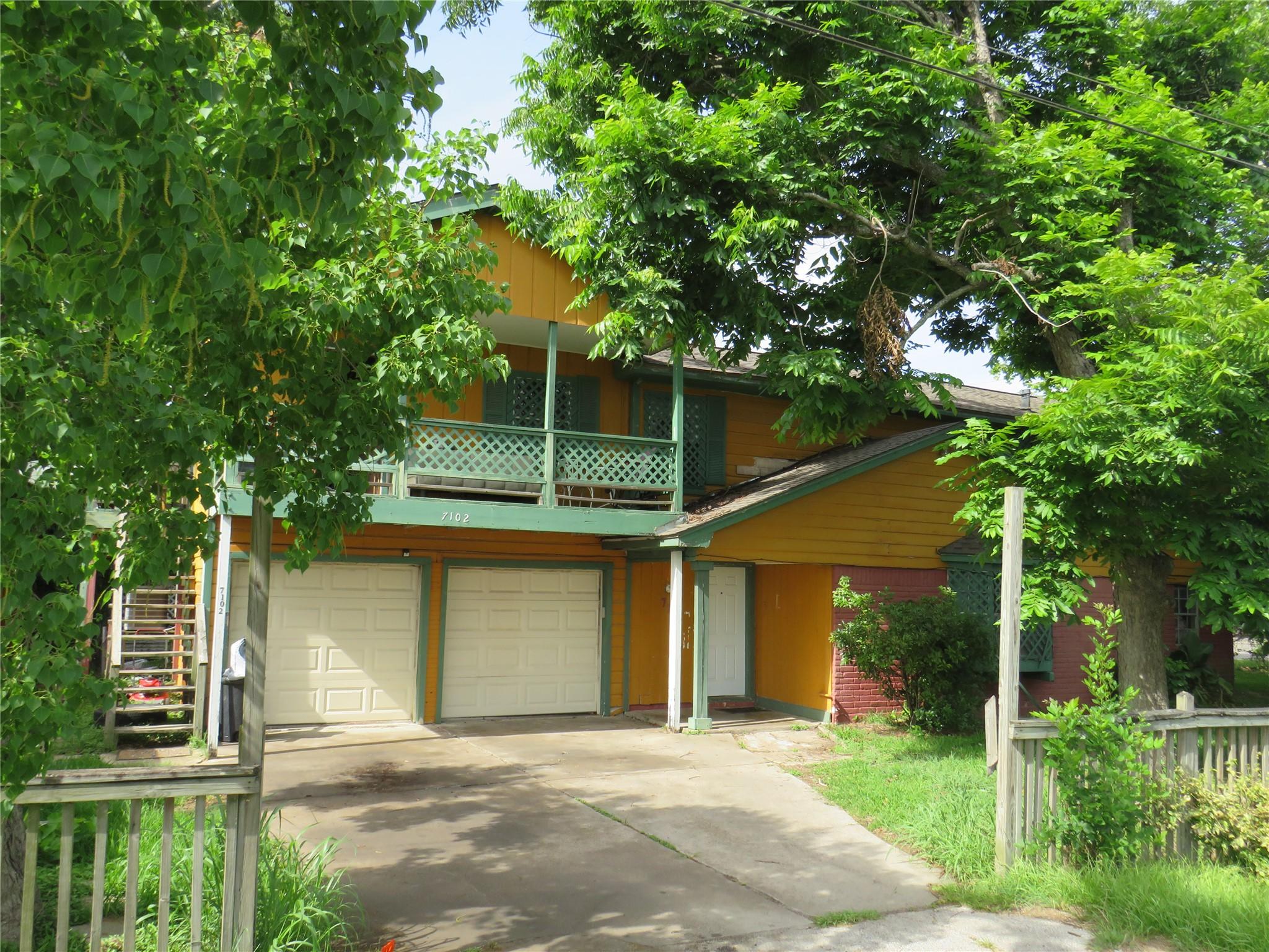 Image 1: Front of Duplex sitting on Highway 6