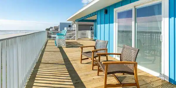 Image 3: Experience coastal living on this expansive wrap-a