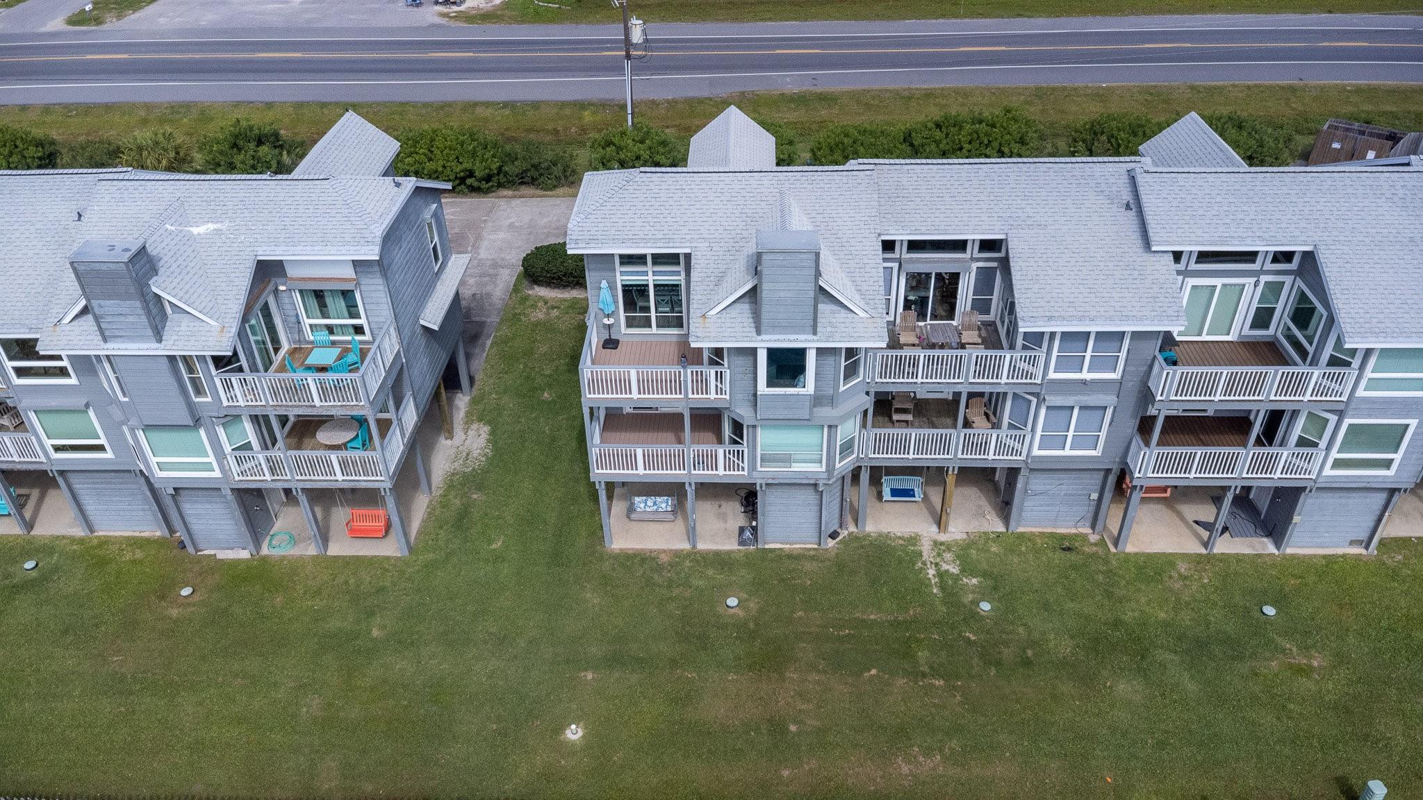 Image 4: This photo shows a pair of modern multi-story town