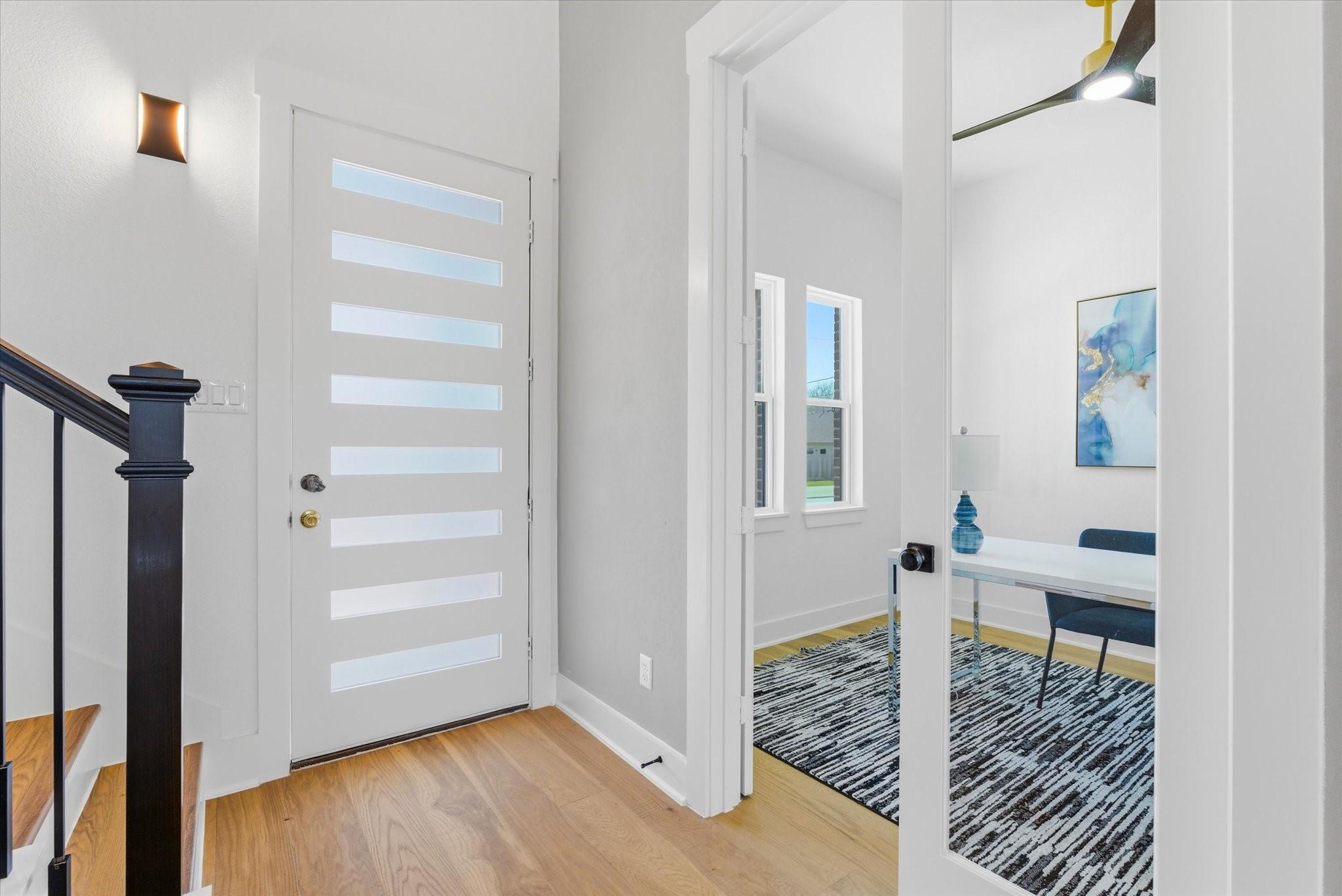 Image 2: Upon entry, a beautiful accent sconce adds warmth