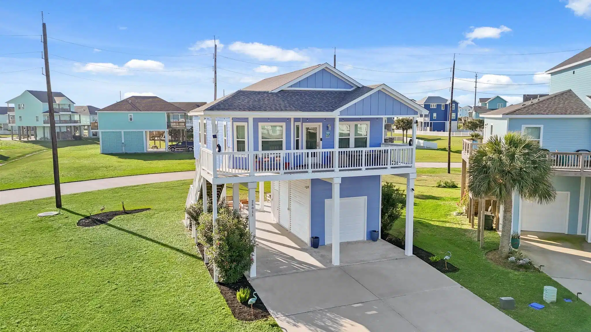Image 1: This charming elevated home features a spacious wr