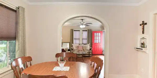 Image 4: Formal dining nestled in the middle of the home, c