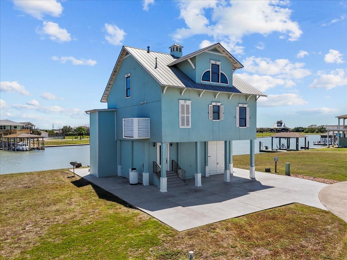 Image 2: An elevated coastal home offers a picturesque wate