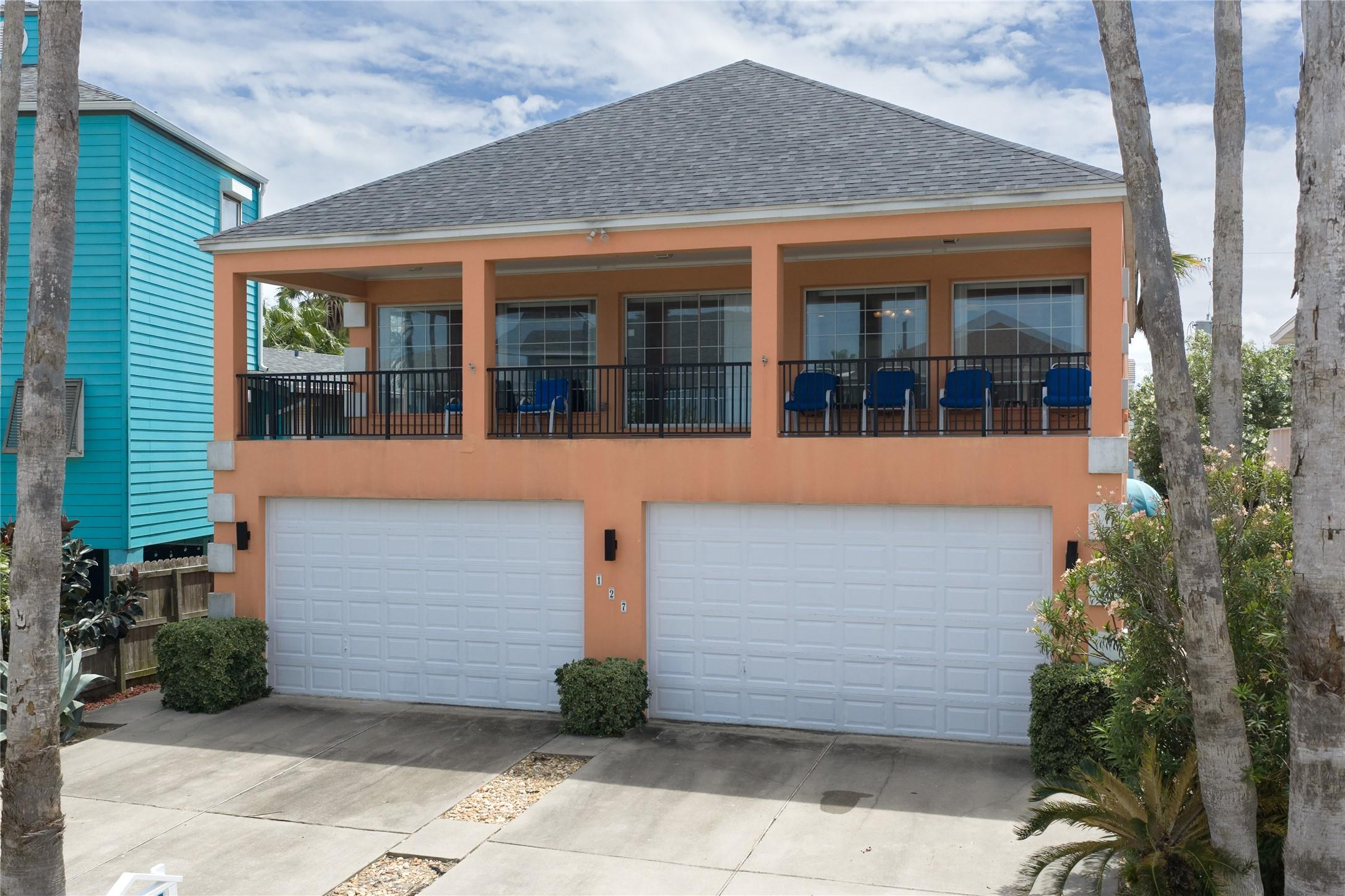 Image 1: This is a two-story home with a vibrant exterior f