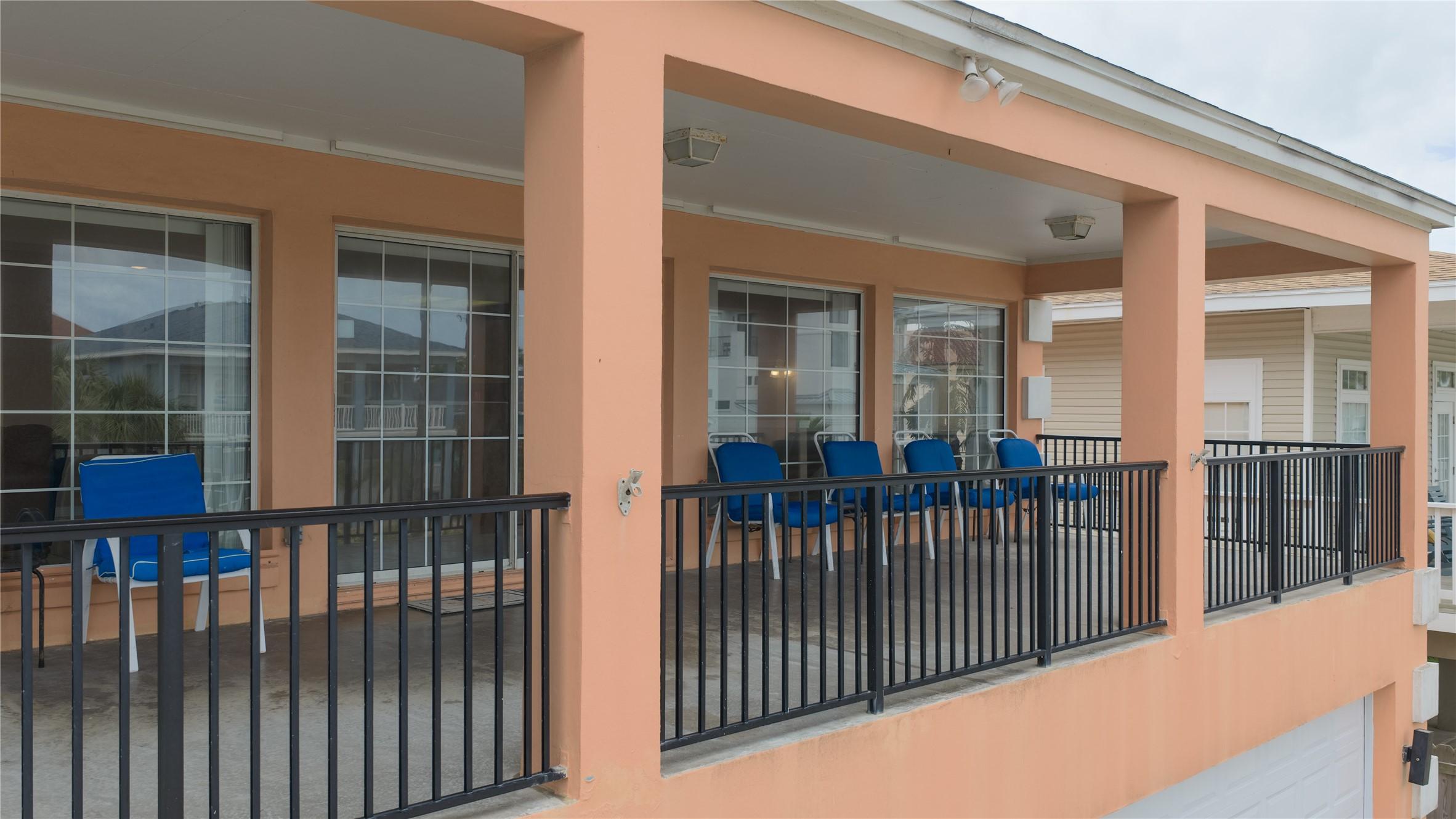 Image 2: This photo showcases a spacious, covered balcony w