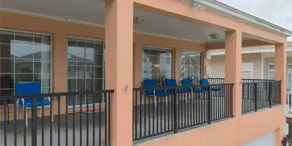 Image 2: This photo showcases a spacious, covered balcony w