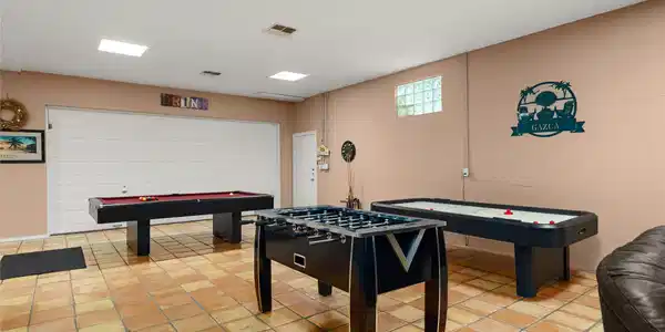 Image 4: This spacious game room features saltillo tile flo
