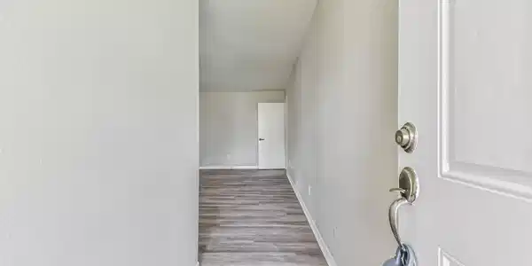 Image 2: Entryway leads you into the living room.