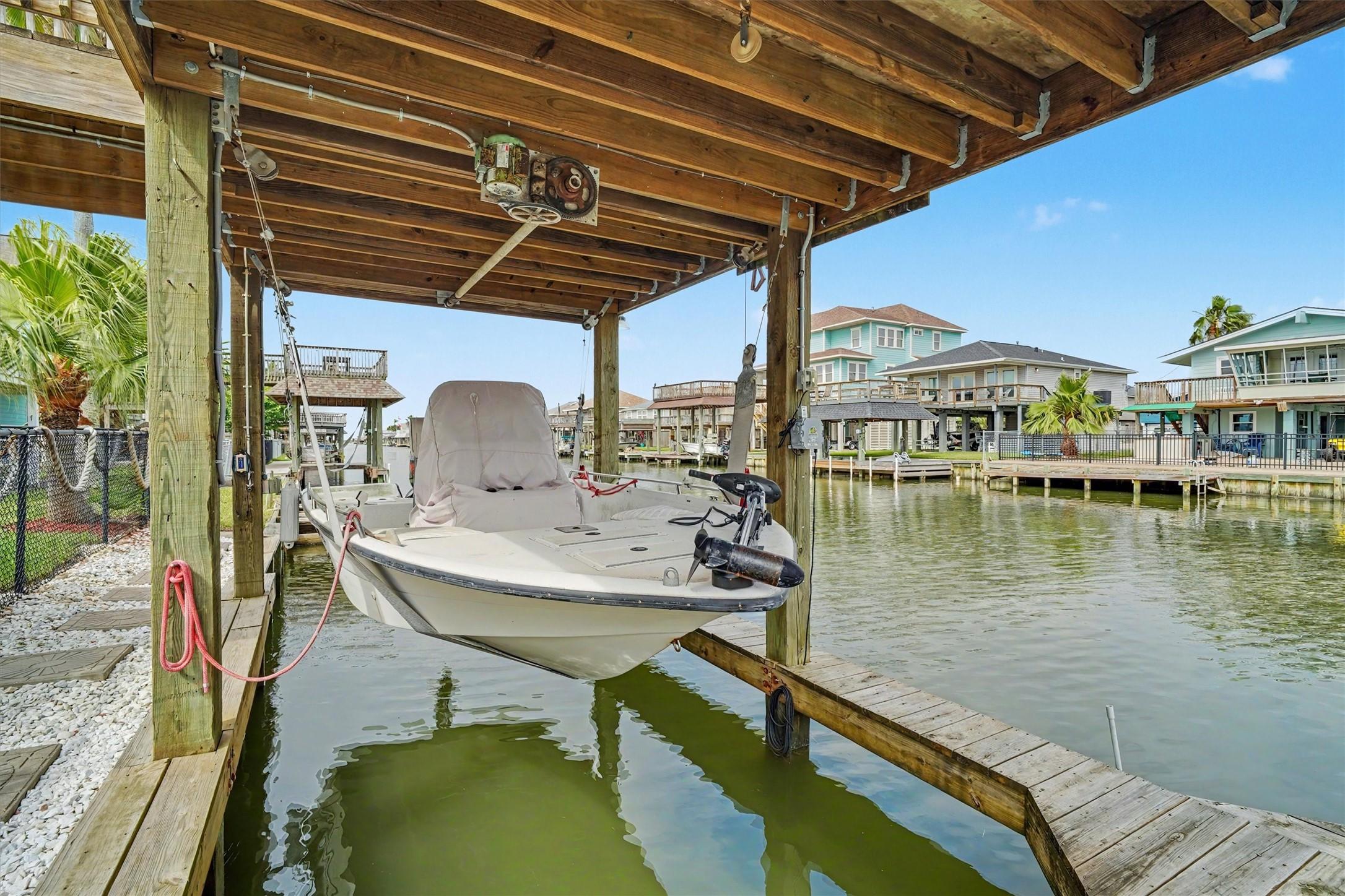 Image 2: The boathouse and boat lift makes living on the wa