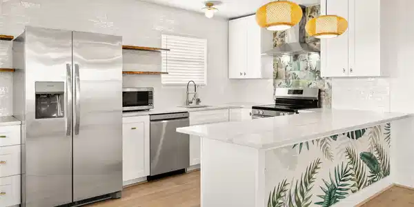 Image 4: This stylish kitchen is open to the living area, d