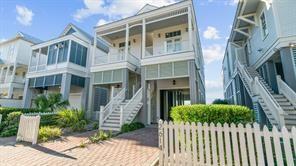 Image 2: This charming two-story home features classic coas