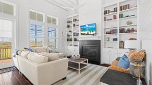 Image 3: This bright and inviting living room features high