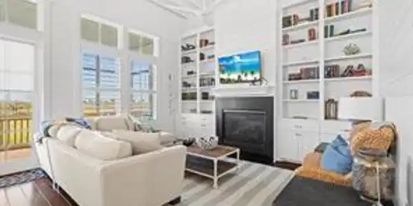 Image 3: This bright and inviting living room features high