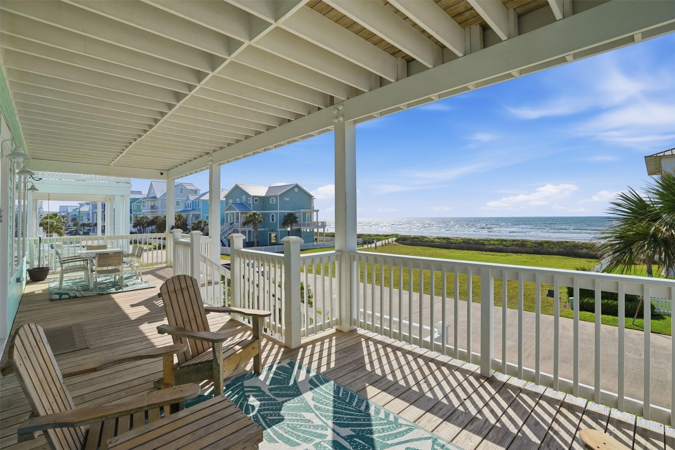 Image 2: This charming beachfront property welcomes you wit