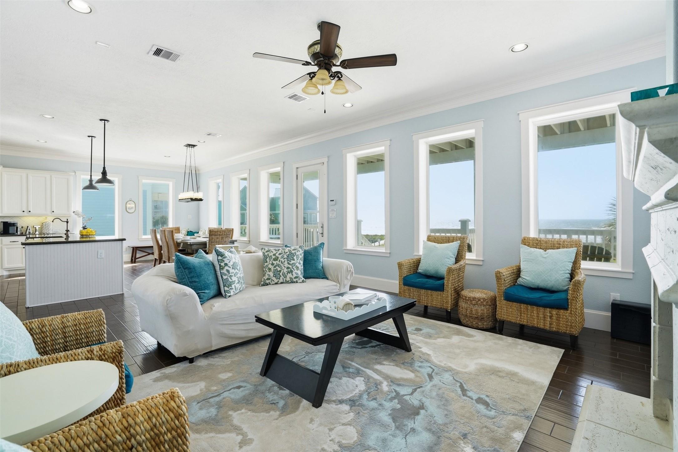 Image 3: Bright and airy living space with large windows of
