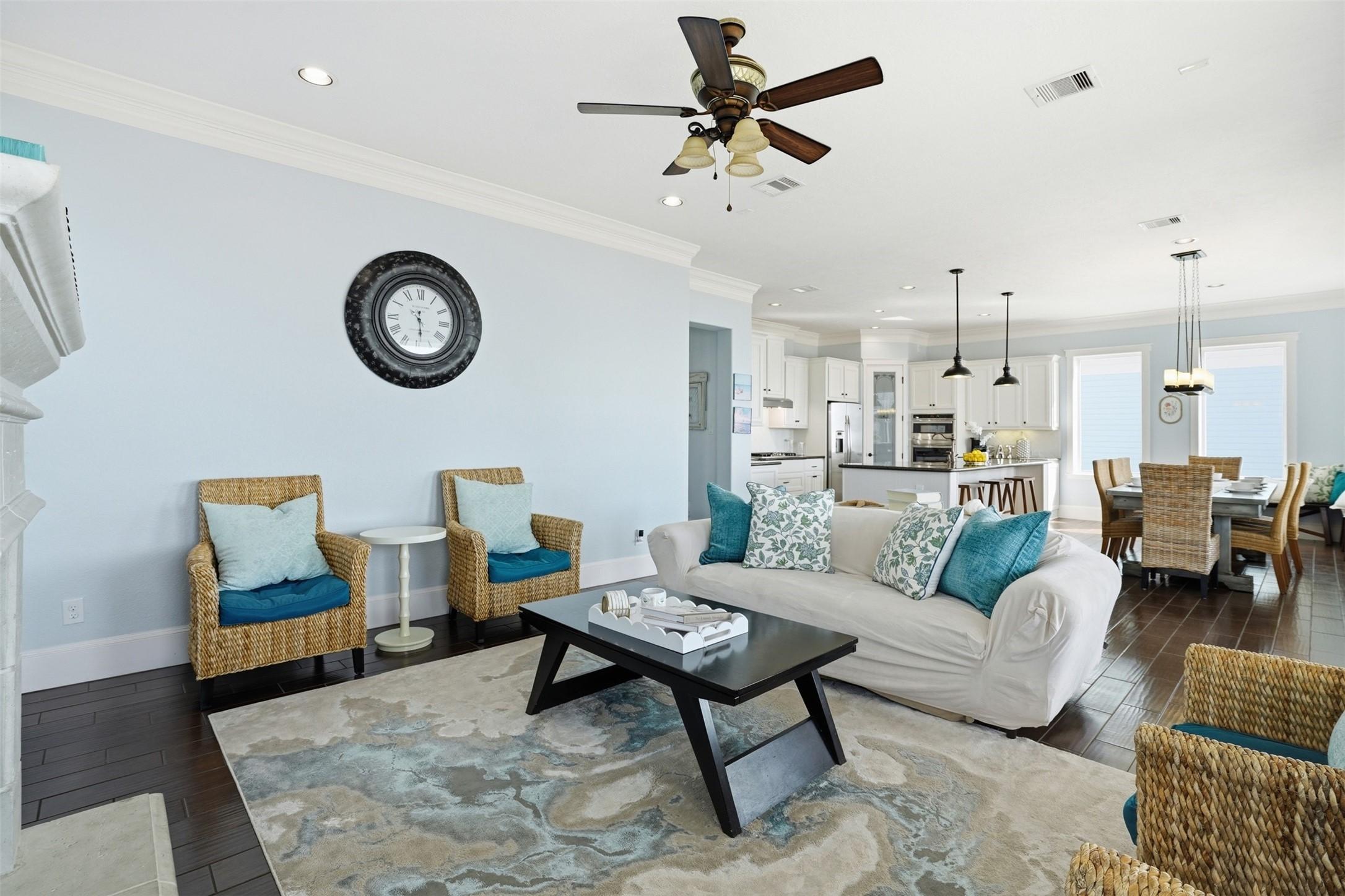 Image 4: This cozy living room features a welcoming firepla
