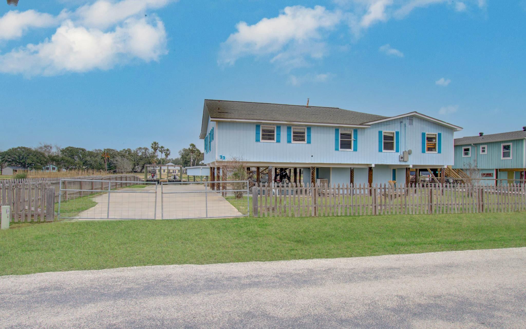 Image 2: Raised for ease and appeal, the home includes a ga
