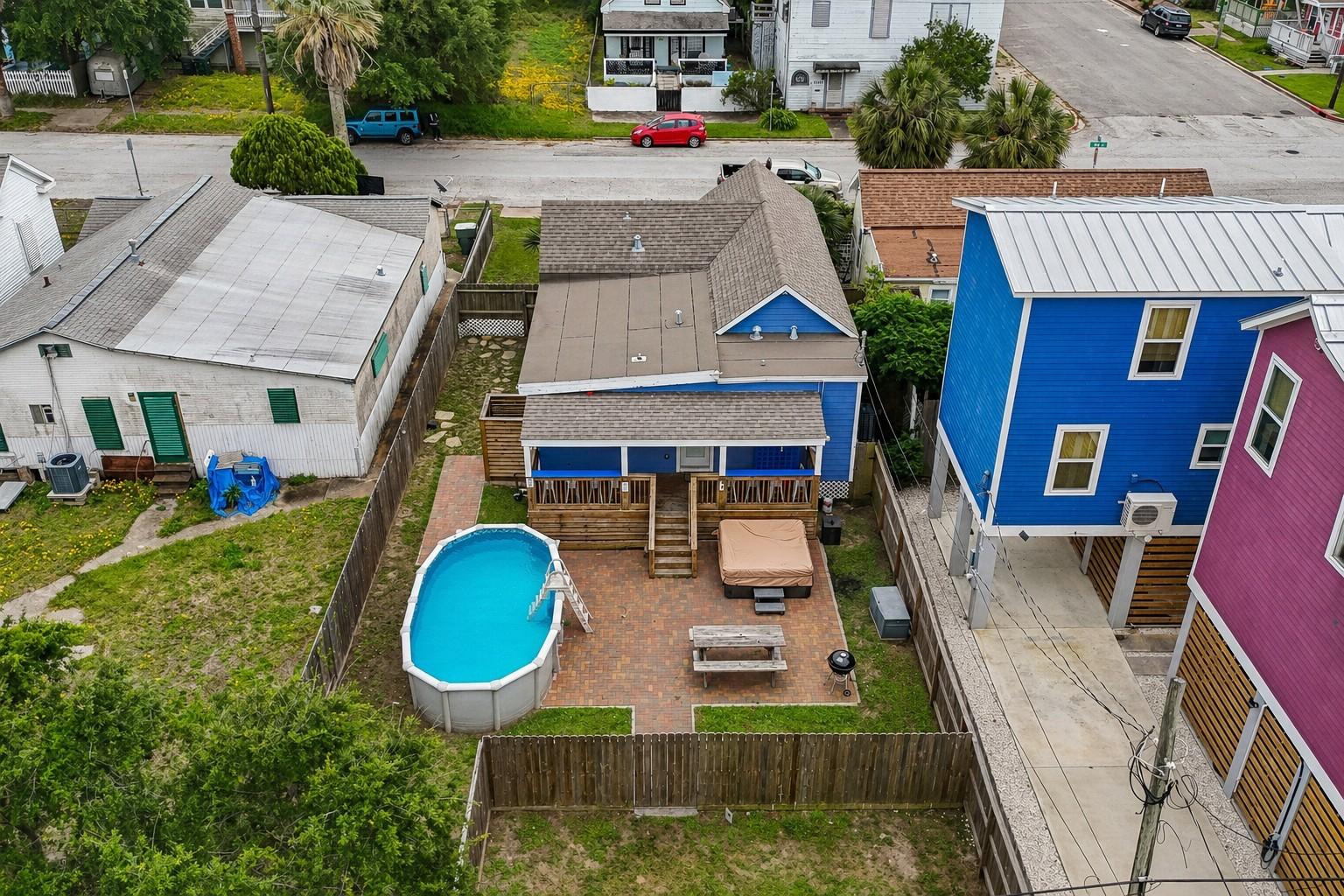 Image 2: Overhead view showcases a private, fenced backyard