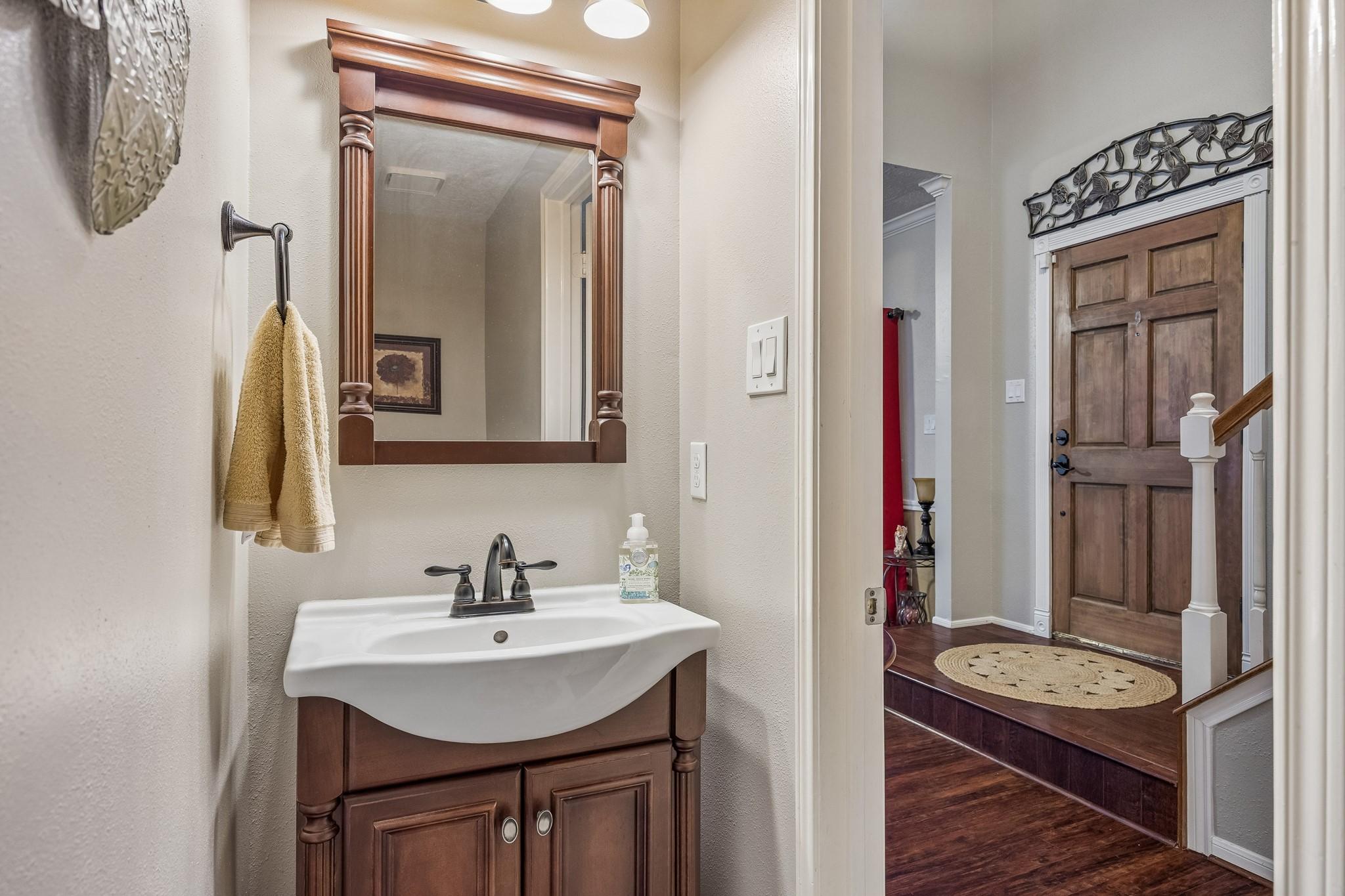 Image 3: This photo shows a powder room on the first floor