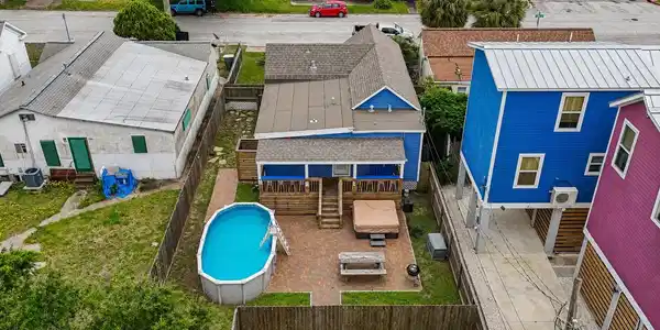 Image 2: Overhead view showcases a private, fenced backyard