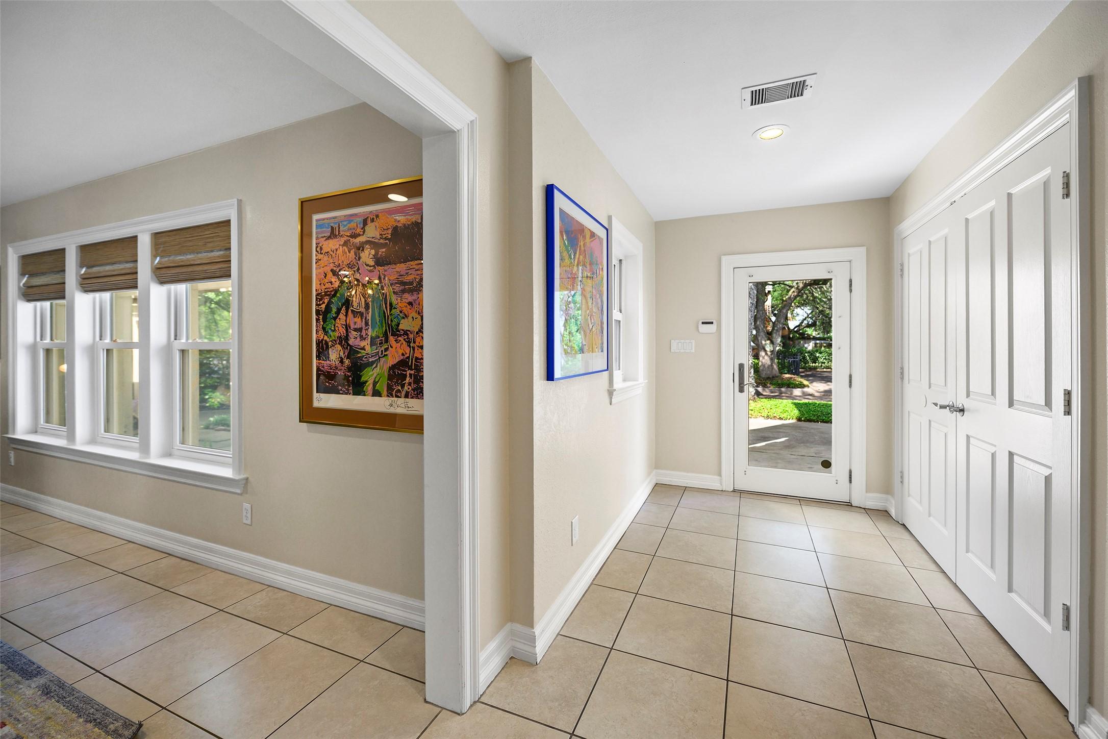 Image 4: A look at the front door and foyer, with oversized